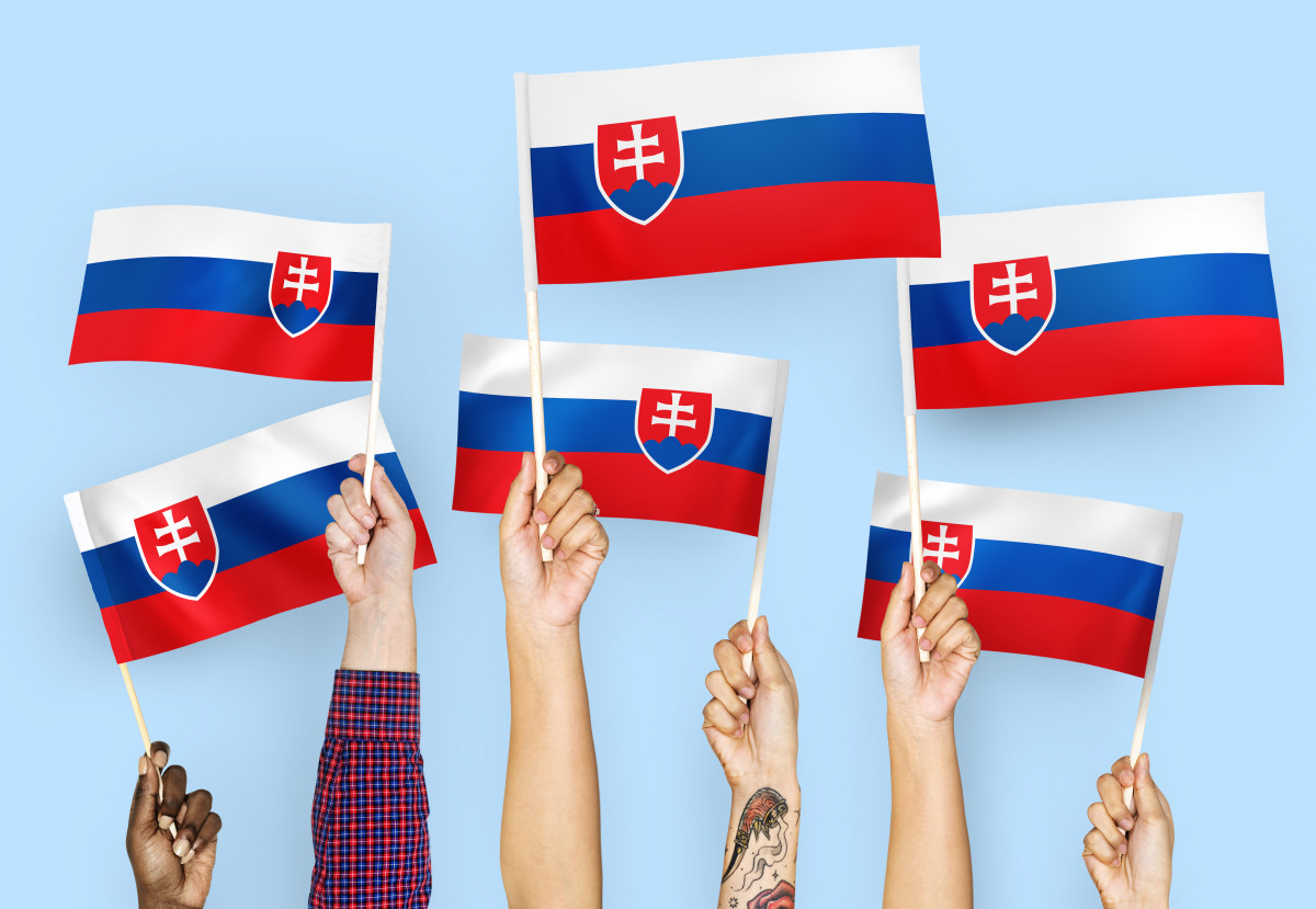 Hands waving flags of Slovakia
